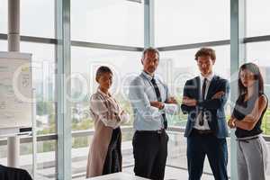 Are you ready to join the white collar workforce. Cropped shot of corporate businesspeople standing with their arms crossed in the office.