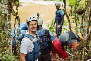 These moments are ones not easily forgotten.... Shot of a group of young friends white water rafting.