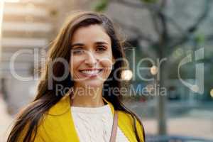 Only you alone can find your own happiness. Portrait of a young woman smiling and in good spirits in the city.