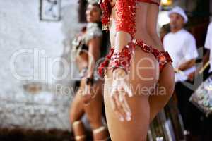 Enhanced through dance. Cropped shot of two samba dancers performing in traditional Mardi Gras wear.