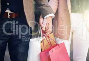 We love to shop together. Cropped shot of an affectionate couple out on a shopping spree.