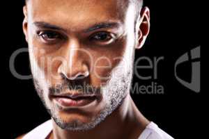 To be continued. Closeup studio portrait of a determined young sportsman against a black background.