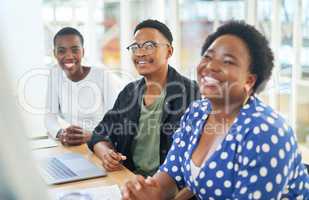 A positivity inspiring project management process. Shot of a group of young businesspeople having a meeting in a modern office.