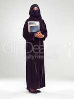 My education is of the utmost importamce. Studio portrait of a young female student in a burqa.