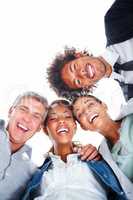 Upward view of happy business people standing together on a white background. Upward view of happy business colleagues standing together on a white background.