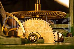 Timeless heritage. Shiny toothed gears of a large clock.