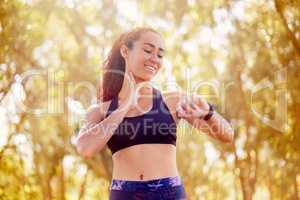 Taking your workout outside makes it LOADS more effective. Shot of a sporty young woman outdoors.