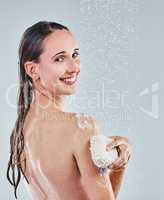 Excuse me while I freshen up. Shot of a young woman taking a shower.