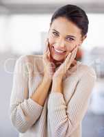 Oh stop with all the compliments, Im blushing. Cropped shot of a stunning shy-looking brunette wearing a knit jersey.