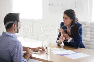 What distinguishes you from all the other candidates. Shot of a businesswoman interviewing a job applicant in an office.