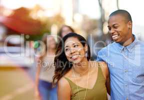 The sweetest days of love. Shot of two happy young couples taking a walk through the city.