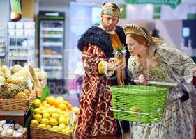 What does one do with this strange item. A view of a king and queen in the supermarket feeling puzzled by the produce.