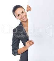 Looking for new business ideas. Studio shot of an attractive young businesswoman holding a blank placard for copyspace.