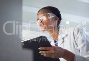 Every contribution is a contribution that matters. Shot of a young scientist using a computer while conducting research in a laboratory.