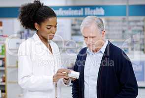 Health care thats simplified and direct to your needs. Shot of a young pharmacist recommending a health care product to a senior citizen at a pharmacy.