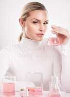 She is the most beautiful pattern of beauty on the fabric of love. Studio shot of young woman making a potion against a white background.