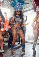 Feel the beat moving through your whole body. Shot of samba dancers performing in a carnival.