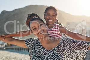 This is how much fun were having. Portrait of a mother and her little daughter enjoying some quality time together at the beach.