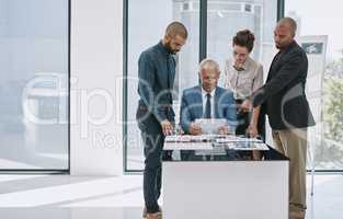 Hes got a few suggestions. Cropped shot of a group of businesspeople in the boardroom.