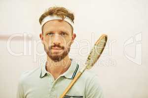 More than squash, its my life. Shot of a confident young man standing on a squash court.