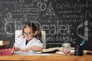 Shes gifted in so many ways. Shot of an academically gifted young girl working in her classroom.