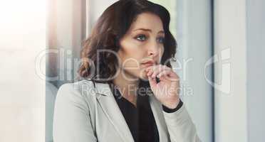 Maybe I need to take depression leave.... Cropped shot of an attractive young businesswoman feeling contemplative at work.