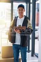 Doing my rounds right on schedule. Portrait of a courier making a delivery in an office.