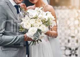 To beautiful beginnings. Cropped shot of an unrecognizable bride and groom standing together.