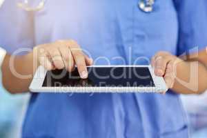 For quick and easy access to all patient records. Closeup shot of a medical practitioner using a digital tablet.