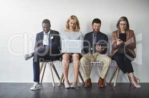 They were all shortlisted, they are experienced in the job. Studio shot of businesspeople waiting in line against a white background.