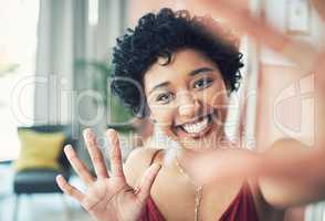 Im back with some more beauty tips. Cropped shot of a beautiful young woman recording herself at home.