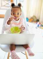 Time for breakfast. Cropped shot of an adorable little girl eating breakfast at home.