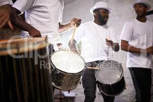 Feel the rhythm of the carnival. Shot of a band playing their percussion instruments in a Brazilian setting.