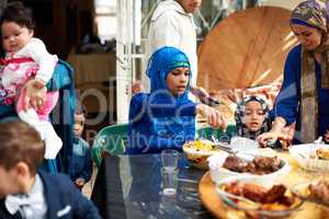 Food brings everyone together. Shot of a muslim family eating together.