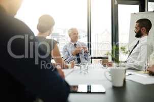 White collar business. Shot of corporate businesspeople in the office.