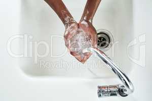 Freshening up. Shot of hands being washed at a tap.