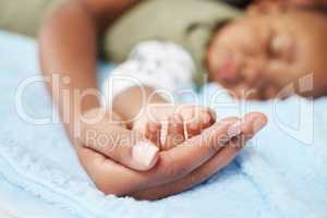 Life didnt come with a manual, it came with moms. Shot of a woman lying with her sleeping baby.