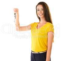 Its time for new beginnings. Shot of a young woman holding a key against a white background.