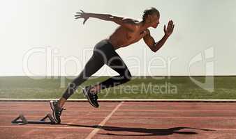 Speed runs through his spirit. An athlete running on track.