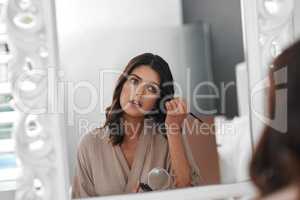 I have to look my best for this day. Shot of a woman applying makeup for a special occasion.