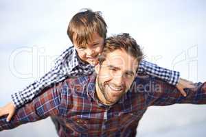 Ill always be there to carry him. Shjot of a father and son enjoying a day outdoors.
