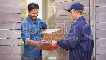 Delivery with a smile. A friendly delivery man delivering a package to a home.