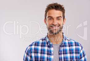 Rugged and manly. Studio portrait of a handsome man against a gray background.