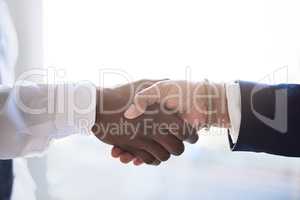 Looking forward to hearing from you. Shot of two unrecognizable businesspeople shaking hands in agreement.