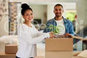 Well invite you to the housewarming. Portrait of a happy young couple unpacking boxes in their new home together.