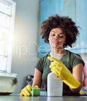Spring cleaning. Cropped shot of an attractive young woman with yellow gloves cleaning her home.