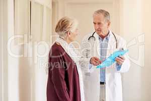 Weve confirmed the diagnosis. Shot of a doctor having a conversation with his patient in the clinic.