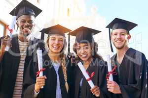 All that effort wasnt for nothing. Shot of happy students on graduation day.