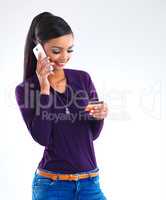 Yes, Id like to place an order.... Shot of a young woman placing a telephonic order with her credit card.