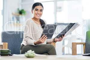 There are tons of apps that could assist you. Portrait of a young businesswoman using a digital tablet while going through paperwork in an office.